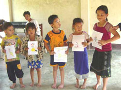 Lao kids holding their art contest entries