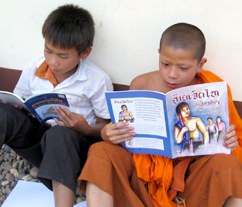 The book Aijethai and other traditional stories from Laos being read