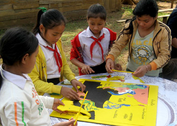 students assemble a puzzle map of Southeast Asia