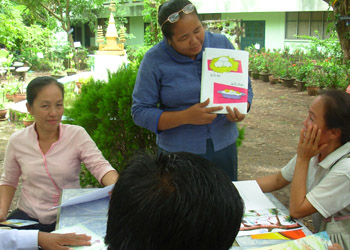 A Lao teacher practices reading aloud