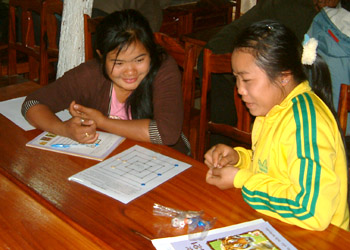 Village reading room volunteers learn a game