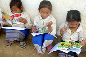 One or more books being read by children in Laos (picture will sometimes vary)