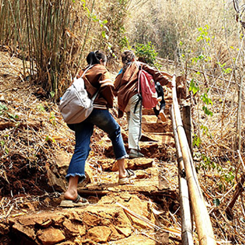 Students from Ton Kit school in Nambak, Laos, hike up the mountain in Nong Khiao (aka Nong Khiaw)