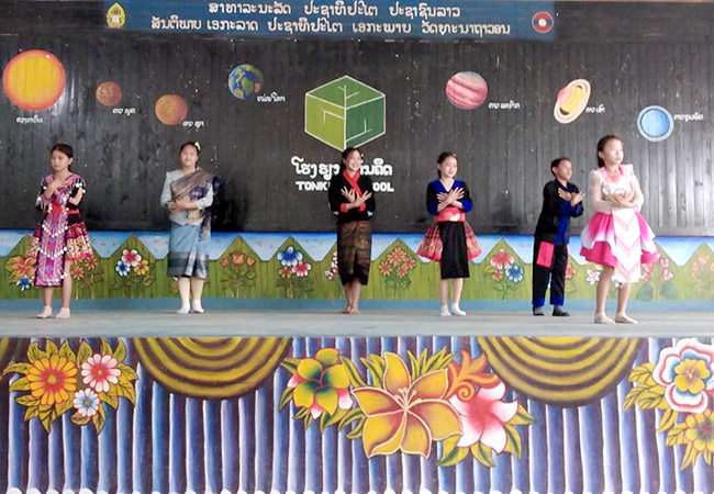 Lao students wear their special-occasion clothes to perform traditional dances at Ton Kit School.
